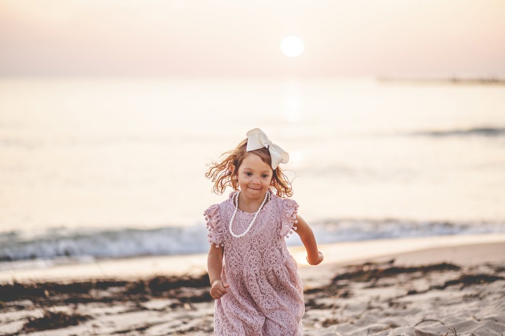 A kid that shows that smiling and jogging improve your health.