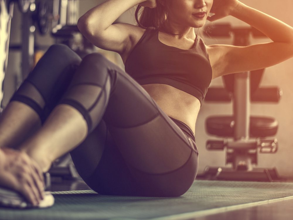 A woman doing sit-ups