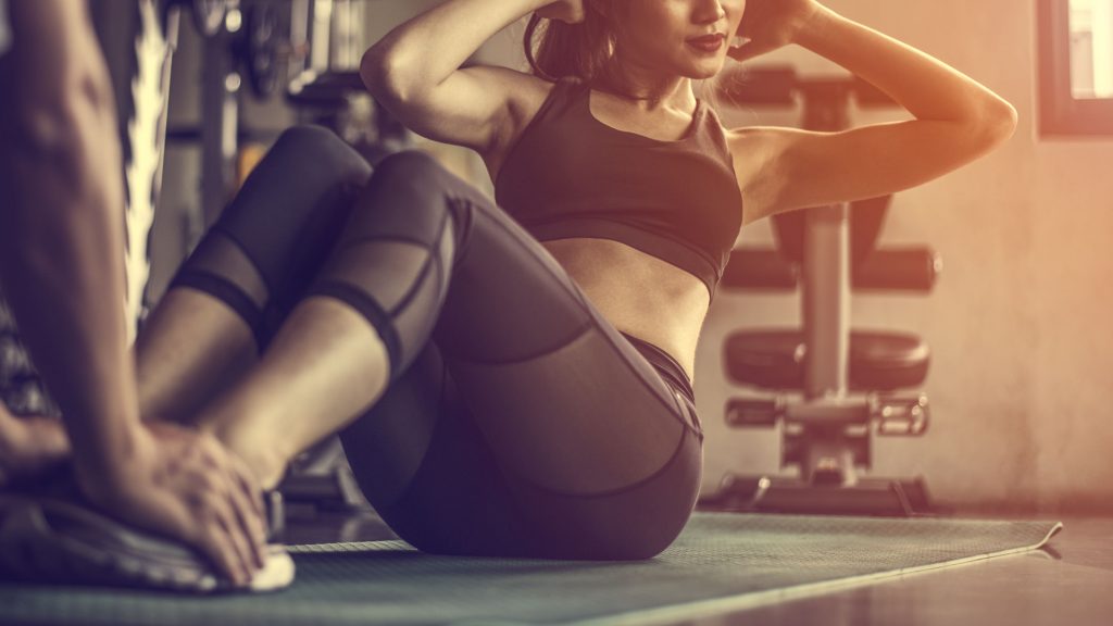 A woman doing sit-ups