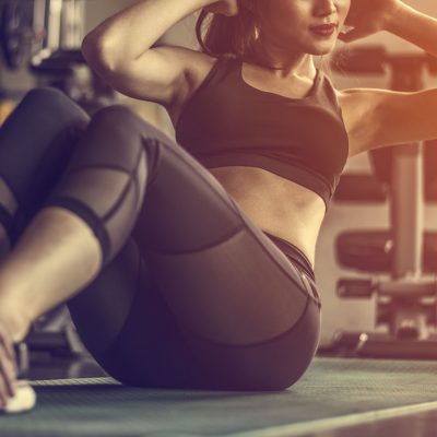 A woman doing sit-ups