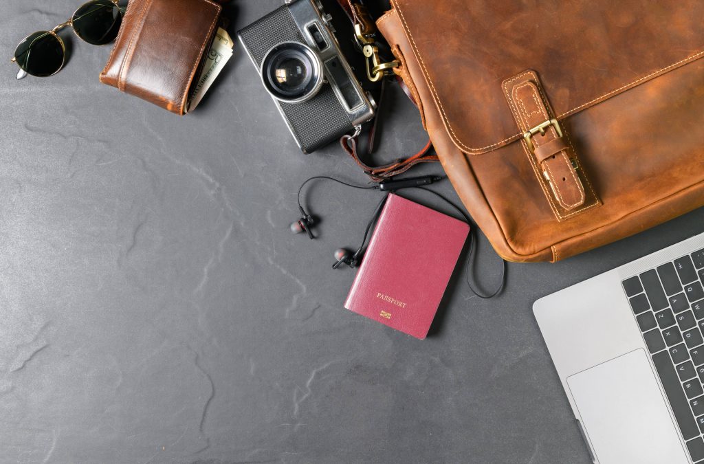 a travel bag with a laptop and a camera 